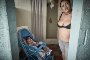 Julia, a convicted robber, is seen in prison alongside her younger child