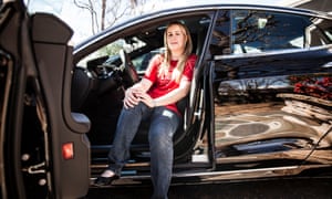 AJ Vandermeyden sits in her Tesla outside her family’s home in San Carlos, California. ‘Unless someone stands up, nothing will change.’