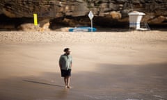 Mostafa Rachwani standing on the sand of a beach