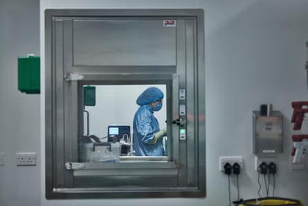A bio-technologist inside a cell suite at Oxford Biomedica