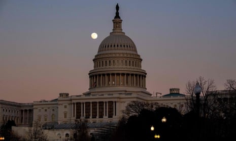 US-POLITICS-CONGRESS-TRUMP-VETO<br>The moon rises over the US Capitol Dome at sunset in Washington, DC, December 28, 2020. - The US House of Representatives dealt a blow to President Donald Trump on December 28 by rejecting his veto of a defense bill, setting the stage for the Senate to deliver the first veto override of his presidency. The Democratic-controlled House voted 322 to 87 to override Trump’s veto of the $740.5 billion bill, with 109 members of the president’s own party siding with Democrats. (Photo by SAUL LOEB / AFP) (Photo by SAUL LOEB/AFP via Getty Images)