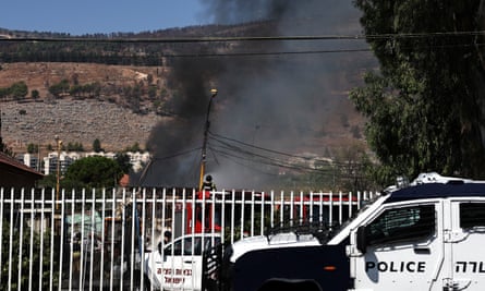 Police and firefighters at the scene of a fire