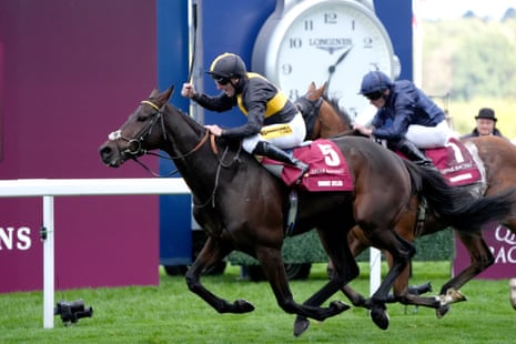 Jockey Patrick McDonald on Mount Atlas leads a close finish during a horse race