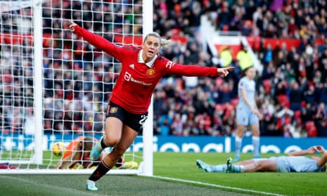Manchester United’s Alessia Russo wheels away in celebration after notching the home side’s third goal