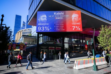 A billboard outside a metro station shows betting odds for the next New York mayor