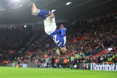 Omari Hutchinson acrobatically celebrates after scoring.