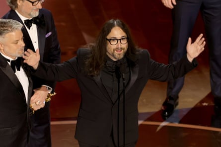 Sean Ono Lennon gestures with open arms on stage