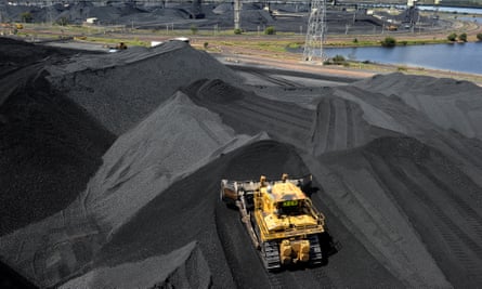 Coal is stockpiled before being loaded on to ships in Gladstone, Australia