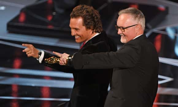 TOPSHOT - Australian Film Editor Lee Smith (R) celebrates next to US actor Matthew McConaughey after he won the Oscar for Best Film Editing for 