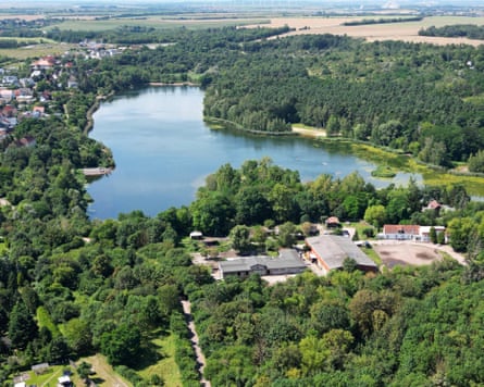 Aerial view of the lake and lush greenery surrounding it