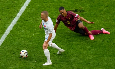Slovakia’s Stanislav Lobotka dribbles past Youri Tielemans against Belgium