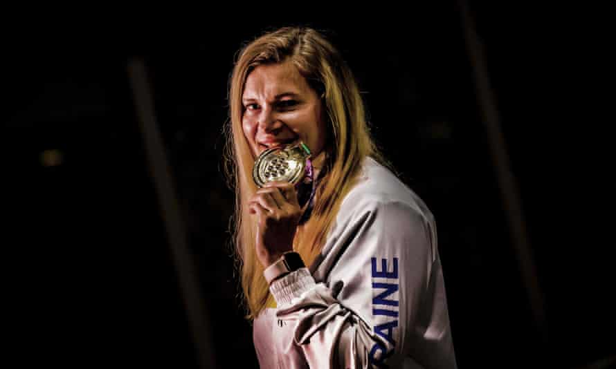 Ukranian hammer thrower Rymma Filimoshkina shows off her gold medal during the 24th Summer Deaflympics, in Caxias do Sul, Brazil.