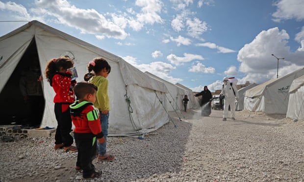 Syrian children by tent