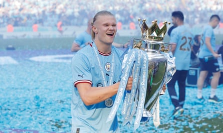 Manchester City's Erling Haaland celebrates winning the Premier League.