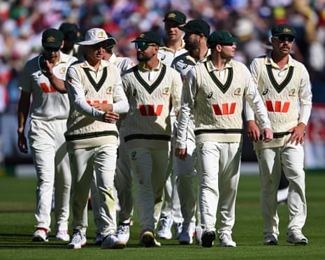 Steve Smith leads Australia off the field after losing to England on day two of the fourth menâÂÂs Ashes Test at the MCG