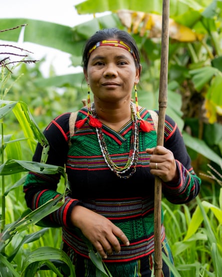 A south-east Asian woman in traditional dress and bead headband