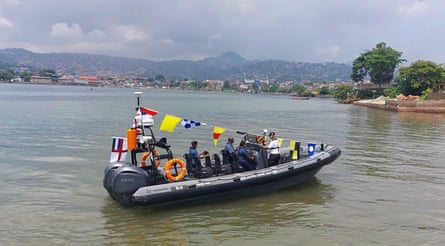 A rigid-hull inflatable boat in a bay