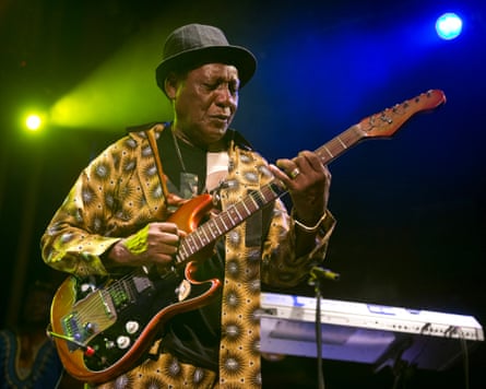 Ebo Talor with guitar on stage