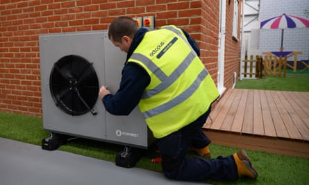 An engineer checks the installation of a heat pump at the Octopus Energy training facility in Slough, Berkshire.