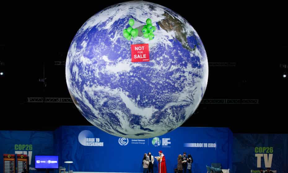 Greenpeace demonstrators raise a banner at Cop26, but the geopolitical context always made it unlikely sufficient progress would be made.