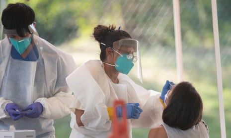 Medical technicians perform Covid-19 tests in Austin.