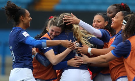 Joanna Grisez is mobbed by her teammates after scoring France’s second try in their 40-0 Six Nations win against Wales