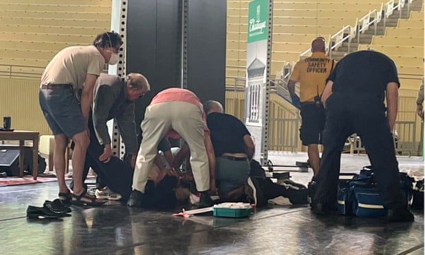 Rushdie is tended to after he was attacked during a lecture.
