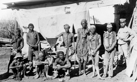 A soldier, probably German, supervising Namibian war prisoners some time between 1904 and 1908