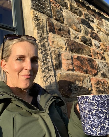 Zoe Fletcher - sitting outside Middle cottage in Northumberland. Enjoying the peace and quiet with a cup of tea in the winter sunshine.