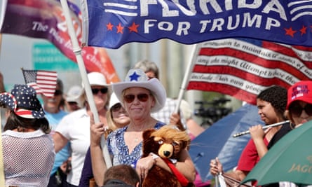 Trump supporters stand outside Palm Beach international airport.