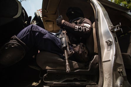 A policeman patrols the streets of Port-au-Prince, Haiti, on 20 March 2024.