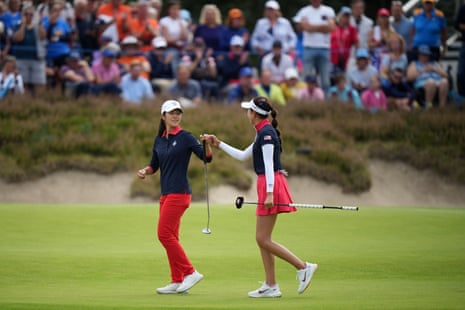 United States' Andrea Lee (left) bumps fists with Yealimi Noh after holing a putt on the 15th green.