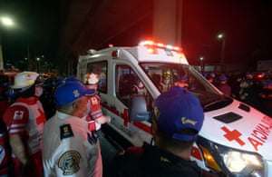 Members of the Mexican Red Cross work at the scene