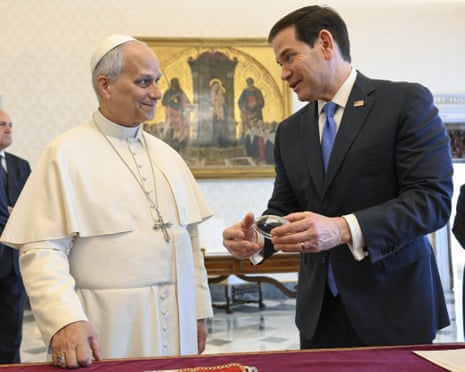Pope Leo XIV exchanges gifts with US secretary of state Marco Rubio during an audience at the Apostolic Palace in Vatican City, Vatican.