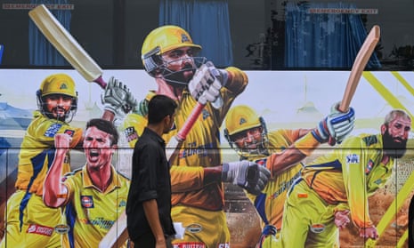A person walks past the bus of Chennai Super Kings, one of the sides labourers were allegedly hired to impersonate.