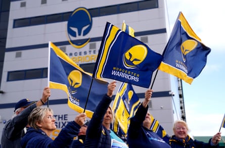Worcester Warriors fans wave flags outside of Sixways Stadium