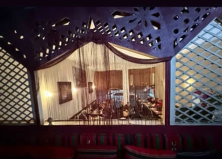 Interior of Abdul's viewed through decorated windows with bead shawls