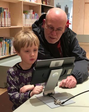 Joris Niekus and his father, Marcel, use an iPad in the Forum in Groningen