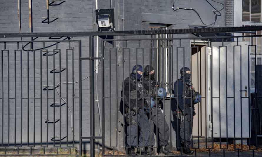 Police officers during a raid in a business park in Weißensee, Germany, in October 2021 as part of an investigation into drug trafficking and arms dealing. The raid was triggered by decrypted data from the short message service Encrochat.