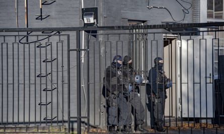 Police officers during a raid in a business park in Weißensee, Germany, in October 2021 as part of an investigation into drug trafficking and arms dealing. The raid was triggered by decrypted data from the short message service Encrochat.