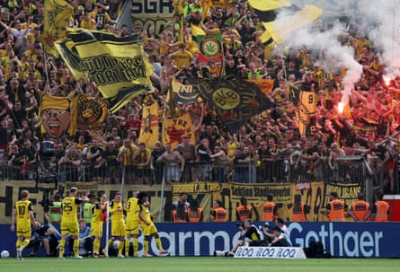 The away fans erupt after Karim Adeyemi’s third goal for Borussia Dortmund.