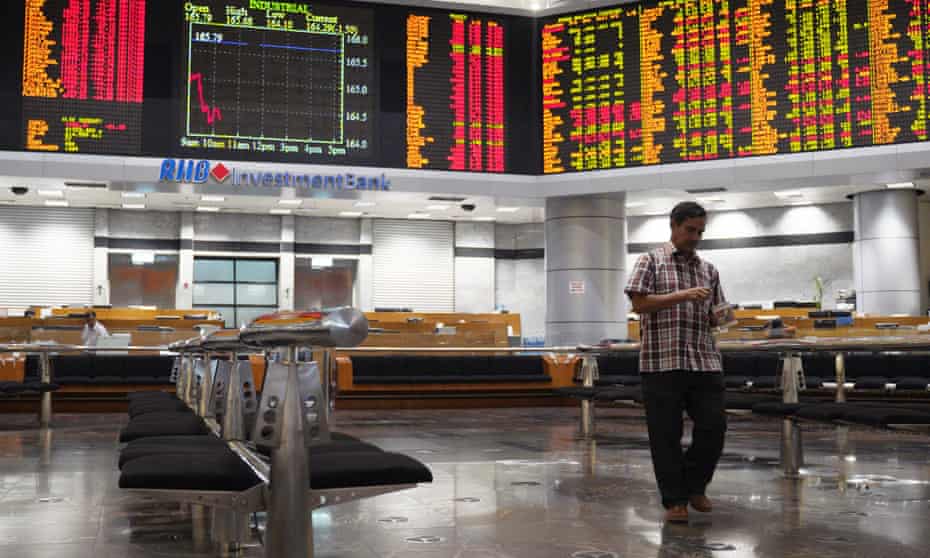 A private stock market gallery in Kuala Lumpur, Malaysia, on Wednesday. Asian shares were mostly in the red.