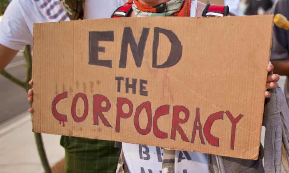 sign saying 'end the corpocracy'