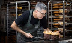 At Pioik bakery in Sydney’s Pyrmont, panettone are skewered and then hang upside down to cool.