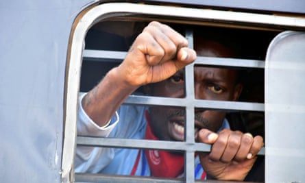 Ugandan presidential candidate Bobi Wine, whose real name is Robert Kyagulanyi, inside a police van after his arrest.