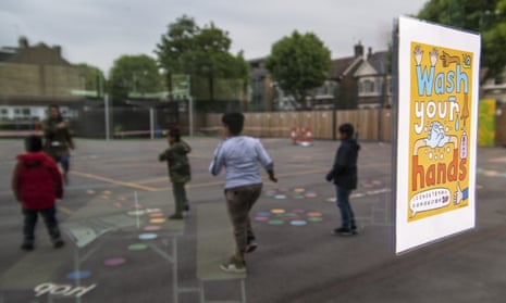 Children maintain physical distancing measures at a school in London