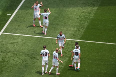 Charles De Ketelaere (left) and teammates celebrate after he equalised against Spain.