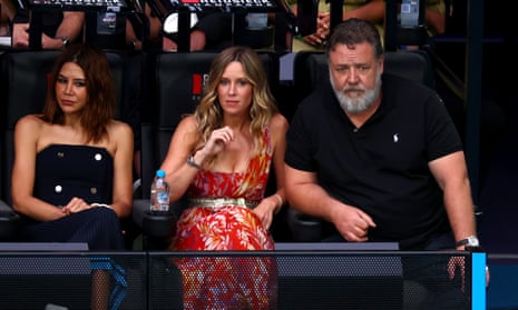 Russell Crowe and his partner and fellow thespian Britney Theriot look engrossed at Rod Laver Arena.