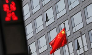 A Chinese national flag flutters outside the China Securities Regulatory Commission (CSRC) building on the Financial Street in Beijing.