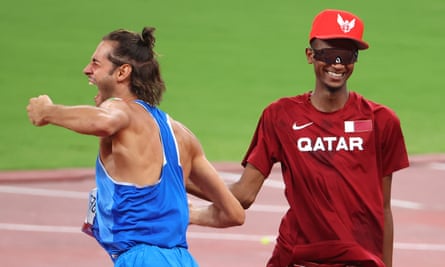 Italy’s Gianmarco Tamberi and Mutaz Essa Barshim of Qatar celebrate after agreeing to share gold in the men’s high jump final.